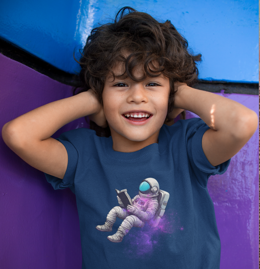 boy in sci-fi themed reading astronaut shirt